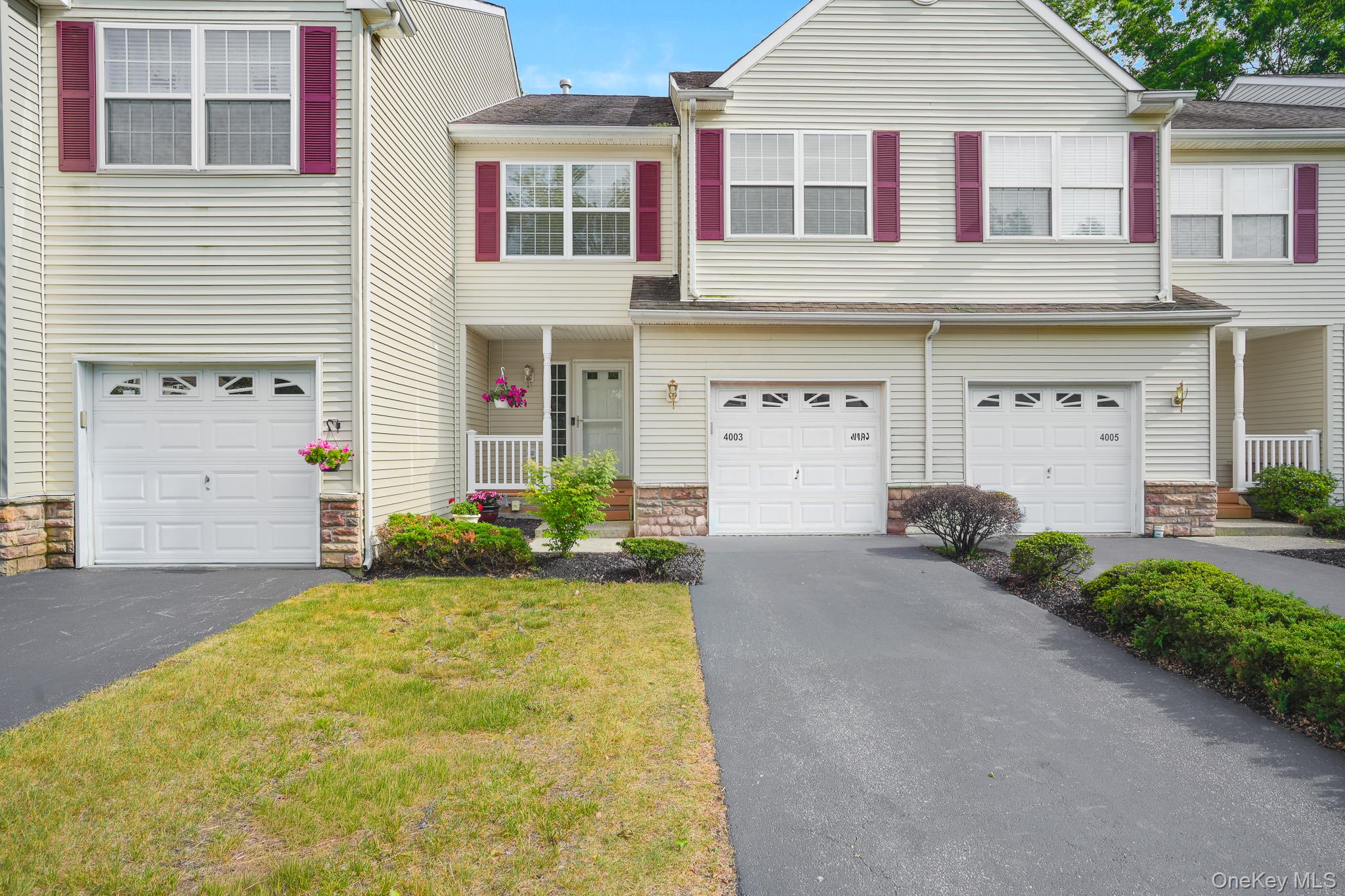 Front of unit with driveway