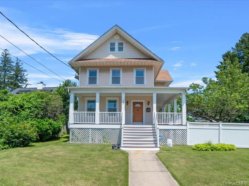 View of front of property with a wrap around porch