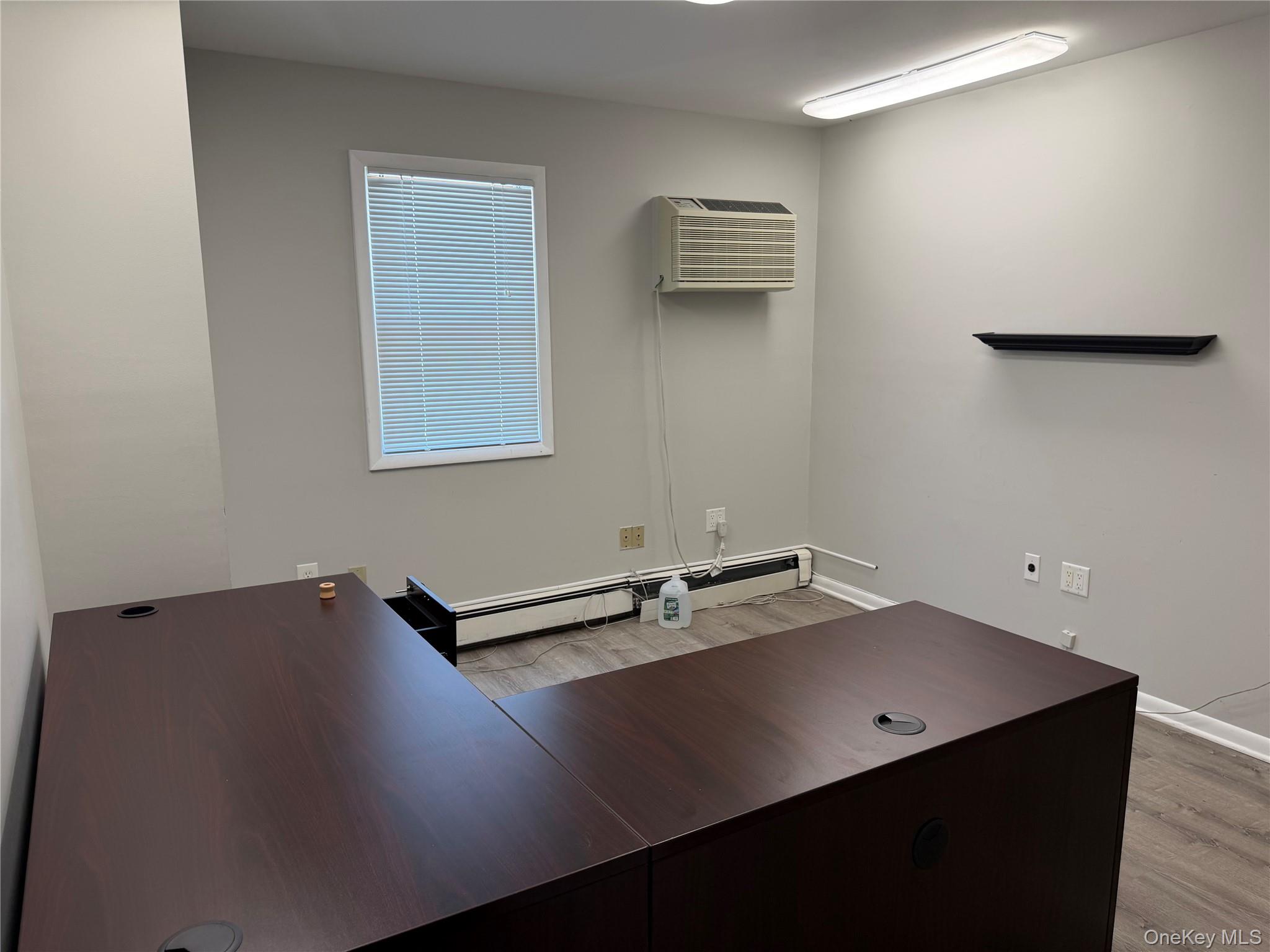 Private office with natural light and updated flooring