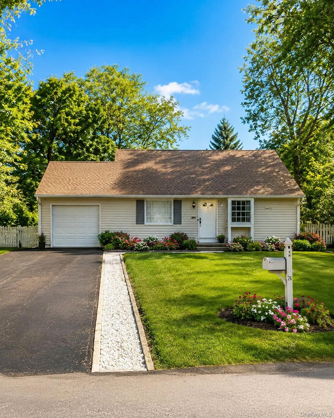 Single-story residence featuring light-colored siding and a brown shingle roof  photos have been digitally enhanced to illustrate the property's potential.